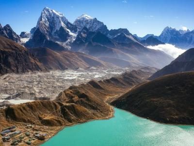 The view from the slope of a relatively small mountain in the Himalayas. In the bottom left, we have a small town called Gokyo, nestled between a large turquoise glacial lake, and an actual glacier right behind it. Humans found a way to squeeze themselves in.

- James Chou